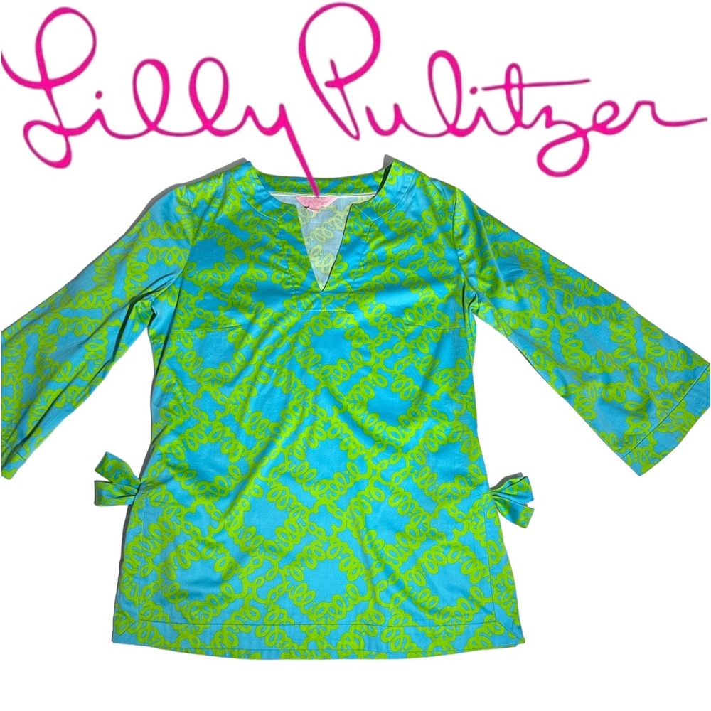 Lilly Pulitzer blue top with “Lilly “ written all over in green. XS Ties on side